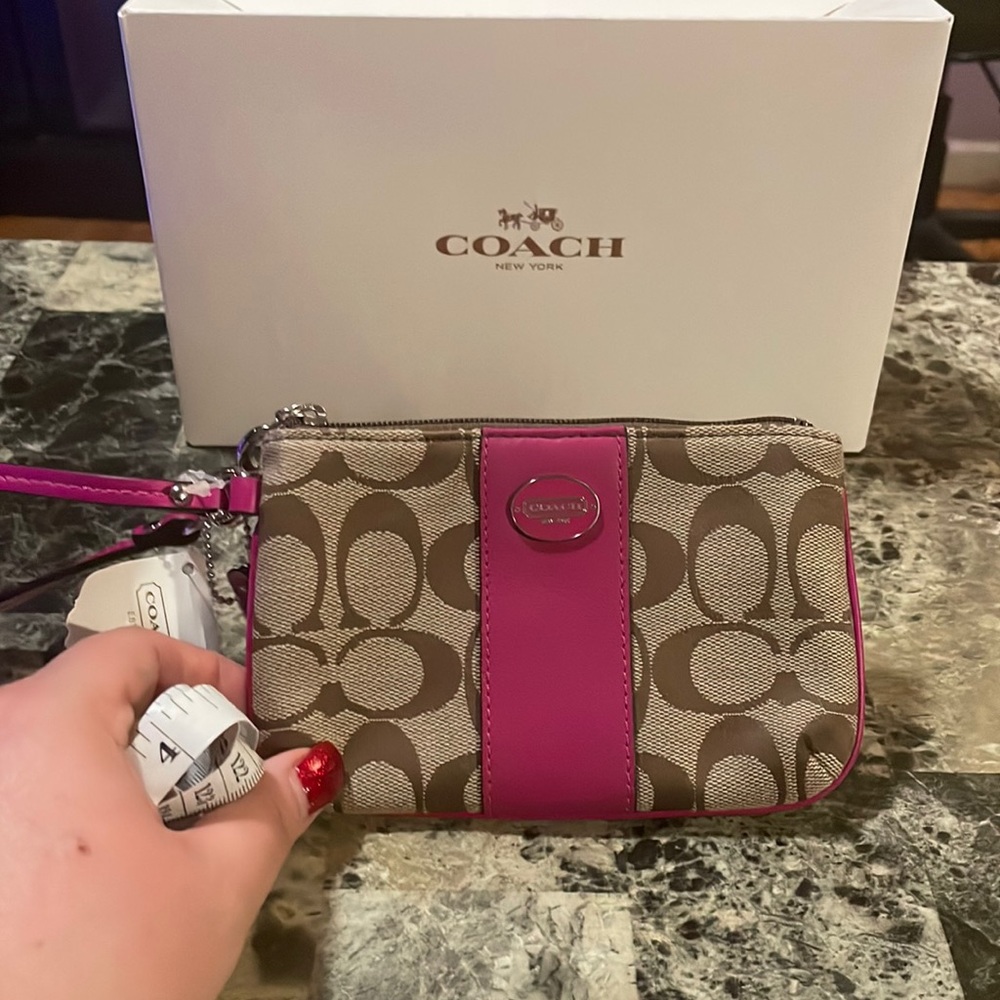 Coach dark pink and tan signature wristlet